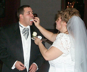 The Bride feeds the Groom