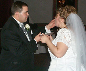 The Groom feeds the Bride.