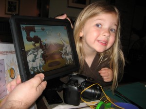 Eva showing off Ansel and Clair's Adventures in Africa game.