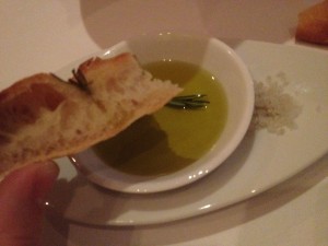 Breads with Oil to dip and coarse salt as well.