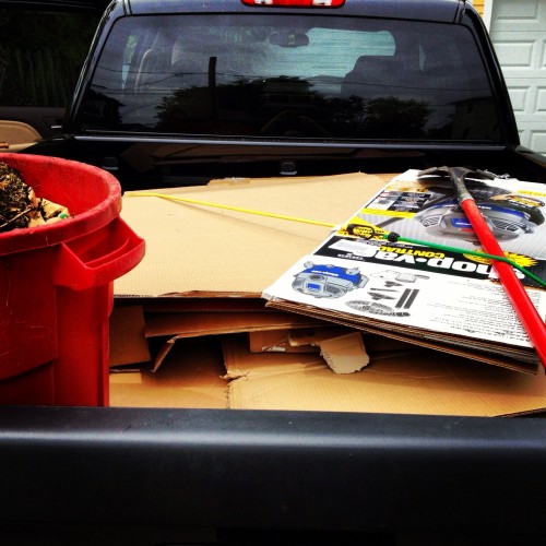 The GMC Sierra Denali with a loaded bed of cardboard and Styrofoam