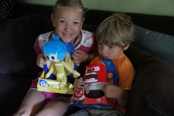 Andrew and Eva with their Inside Out Plushes Joy and Anger