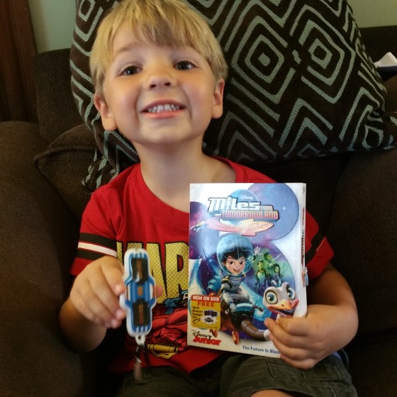 Andrew with his Miles from Tomorrowland DVD and Blast Board Flshlight