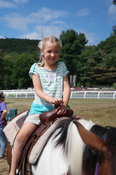 Eva riding a pony