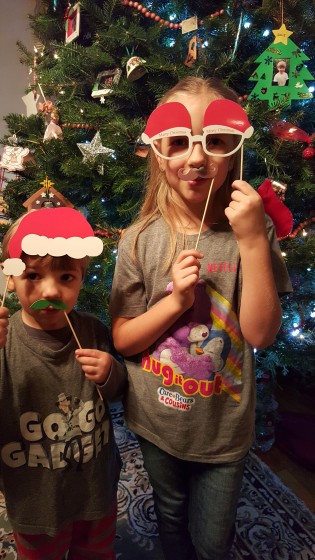 The Kids Posing with Christmas items.