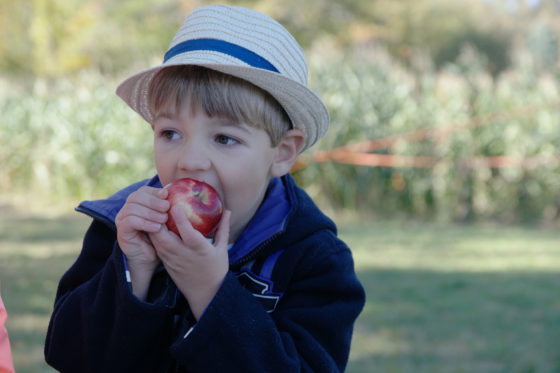 Andrew in a Fedora with an Apple