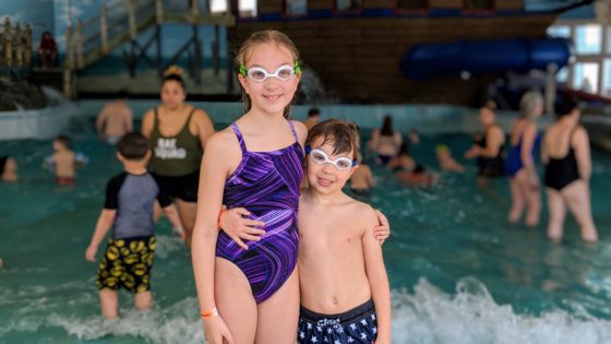 Happy Siblings at the Wave Pool